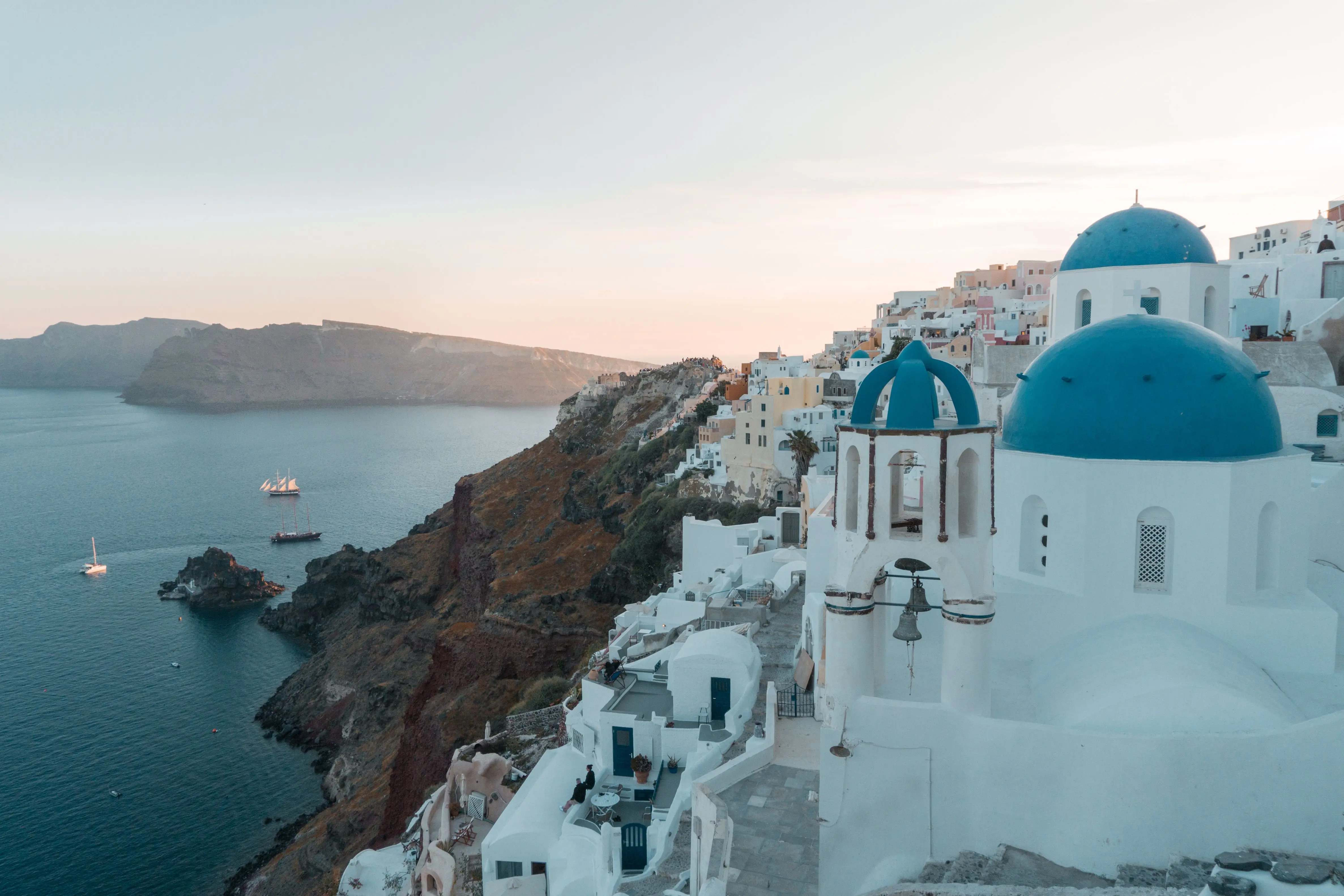Blue-domed churches above the Santorini caldera